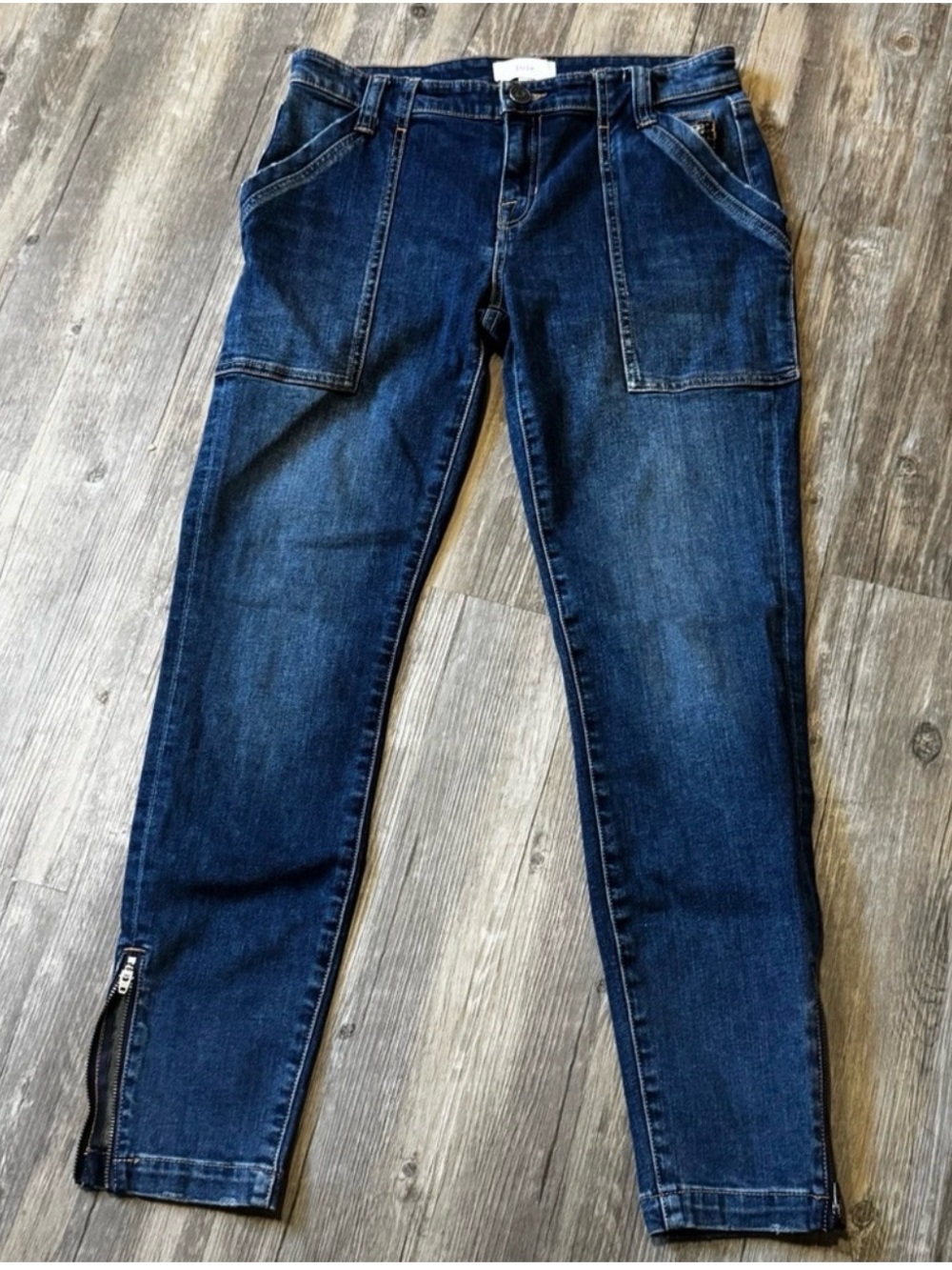 Joie Park Skinny Jeans in a dark wash blue featuring ankle zipper details